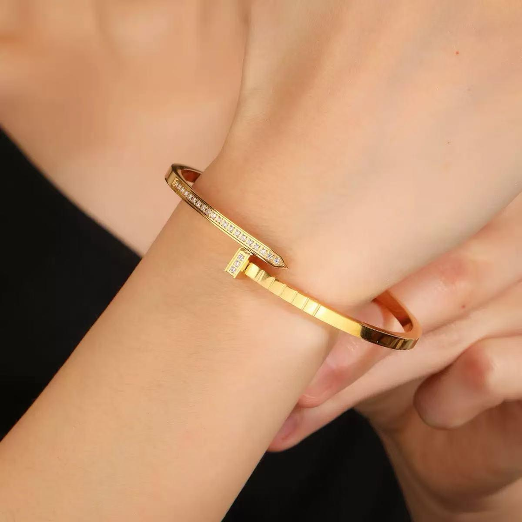 A simple and trendy female couple bracelet studded with nails and diamonds, featuring a starry sky