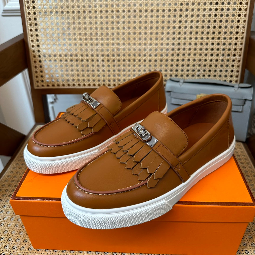 H game sliip-on sneakers fringes