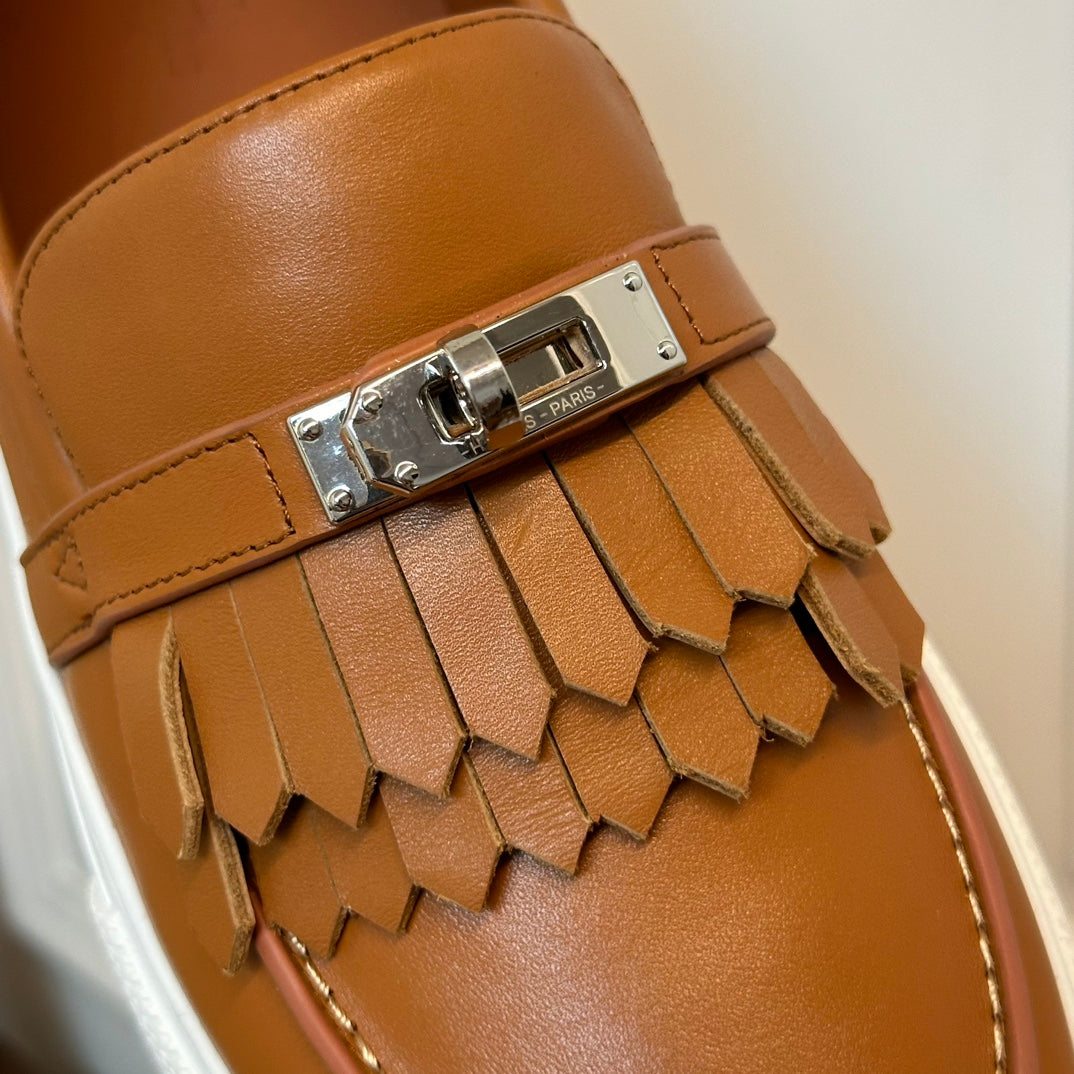 H game sliip-on sneakers fringes