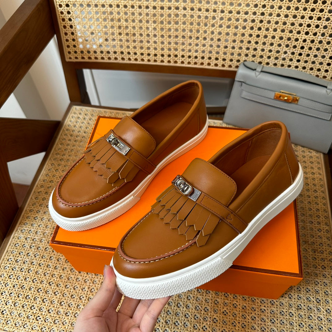 H game sliip-on sneakers fringes