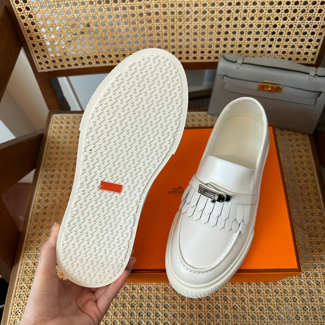 H game sliip-on sneakers fringes