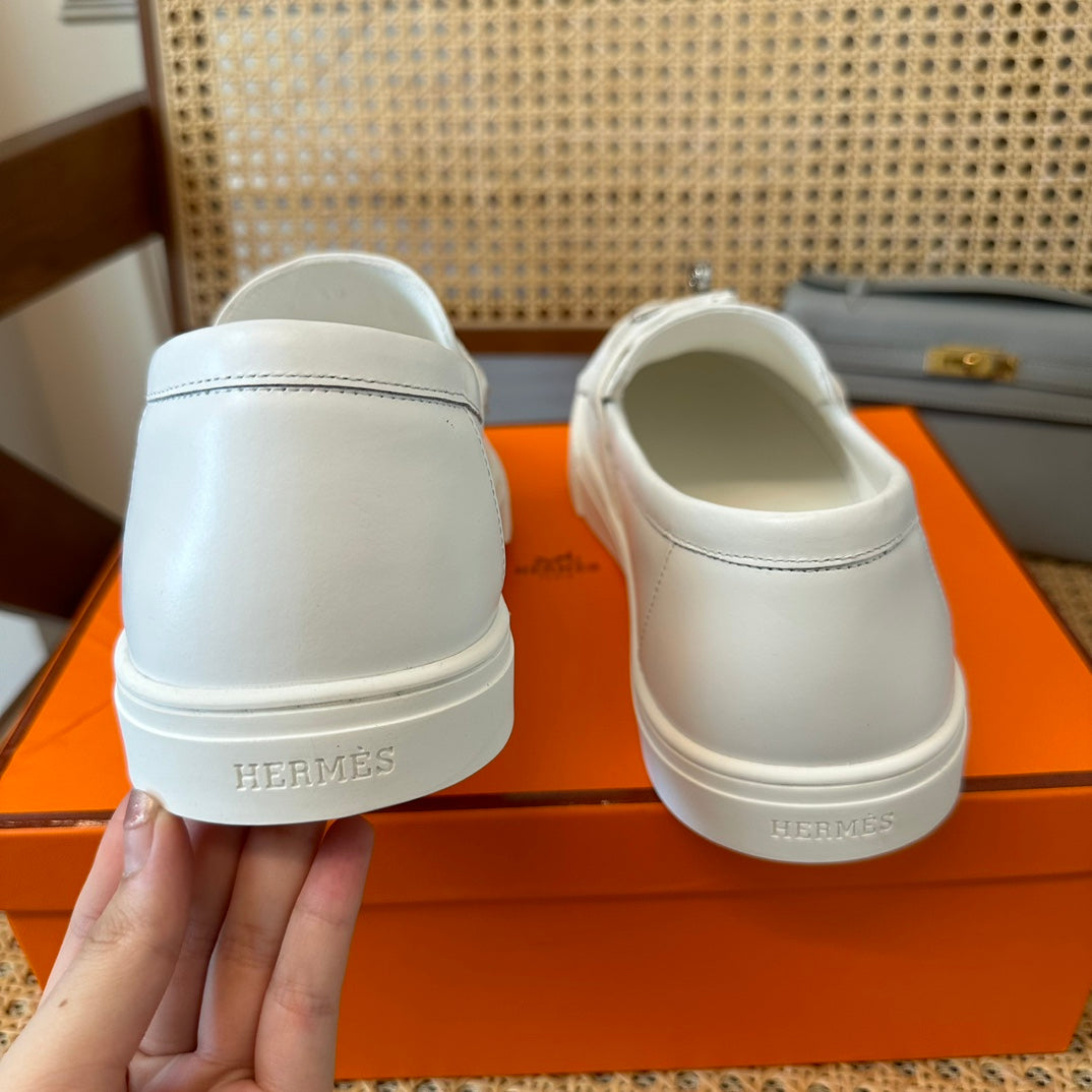 H game sliip-on sneakers fringes