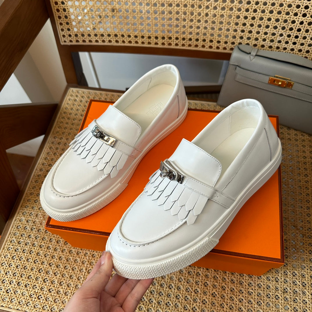 H game sliip-on sneakers fringes